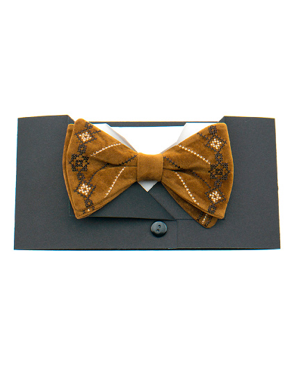 Embroidered light brown suede bow tie with black and white ornamentation - Image #1